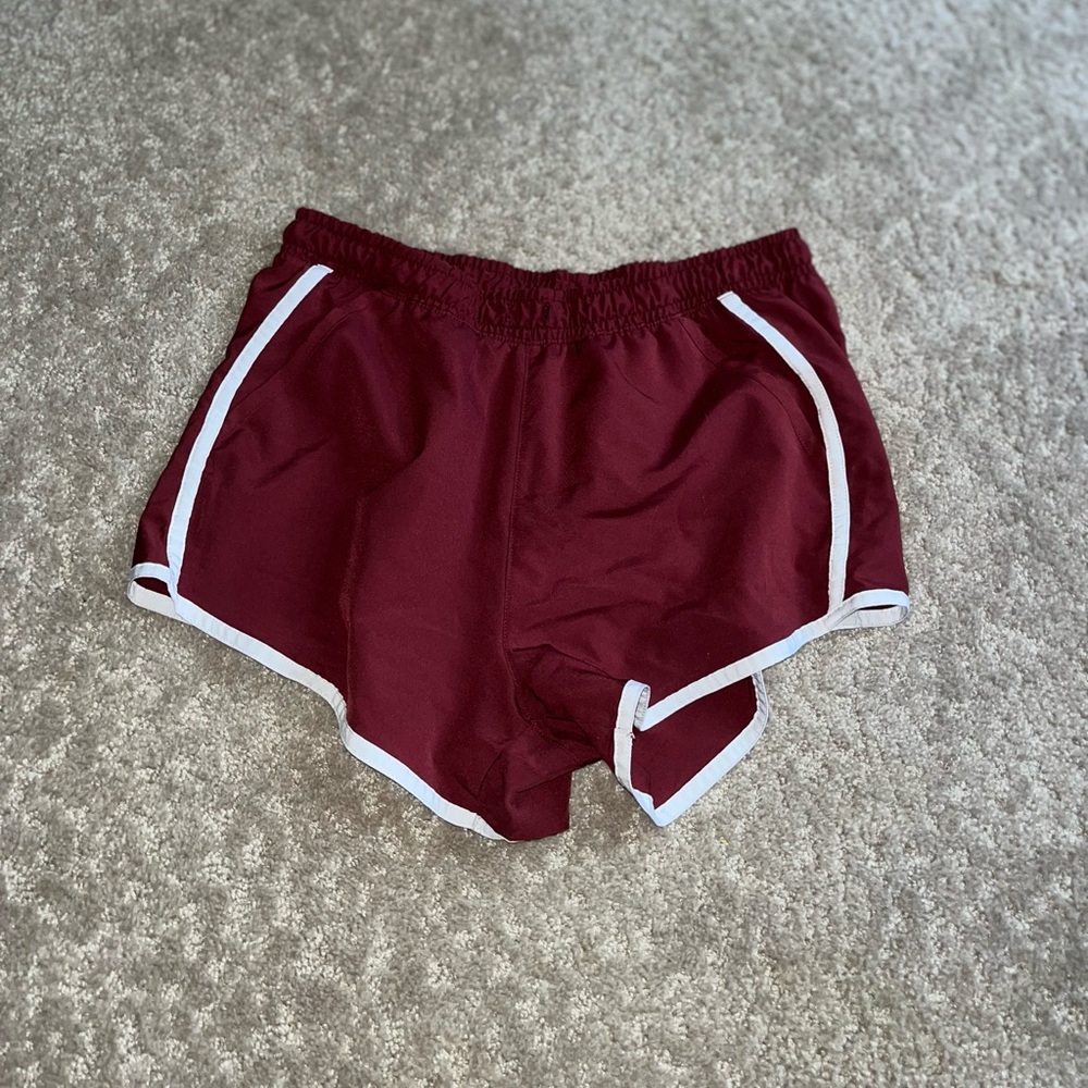 Maroon athletic shorts with pockets